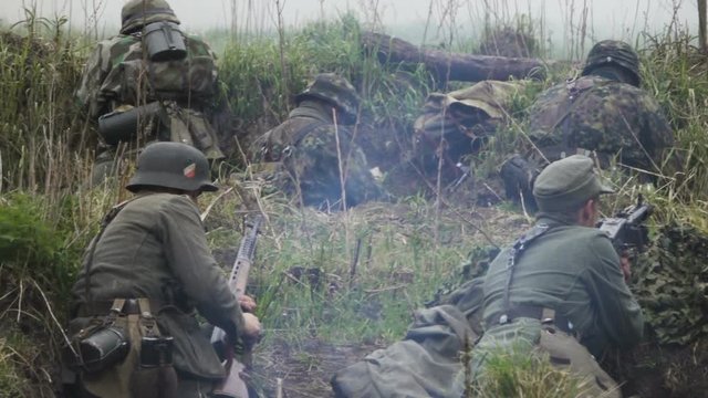 Historical reconstruction of Second World War. Soldiers on battle field during assault on Fort 5 in Koenigsberg. hostilities of Second World war. Slow Motion. Kaliningrad - May 2017 Russian