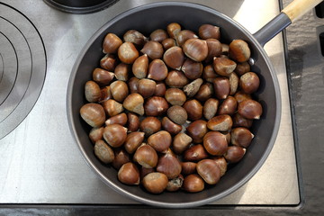 chestnuts in the frying pan on the stove