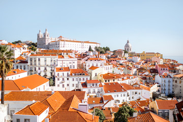 Fototapeta na wymiar Cityscape view on the old town in Alfama district during the sunny day in Lisbon city, Portugal