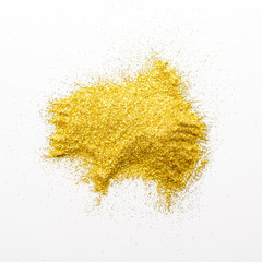 Golden glitter sand texture on white background