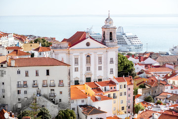 Fototapeta premium Cityscape view on the old town in Alfama district during the sunny day in Lisbon city, Portugal
