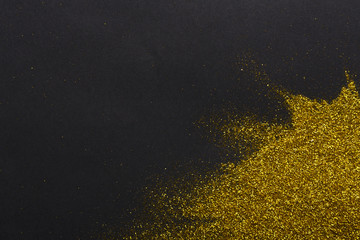 Golden glitter sand texture, abstract background.