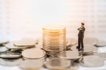 Money, Financial, Business planning and Growth concept, Businessman miniature figure stand on pile...