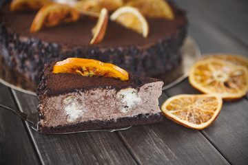Chocolate cake with cream and profiterole