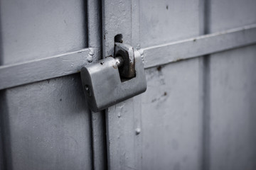 Metallic padlock to a container door