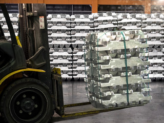 Close up aluminium ingot in bundle handling by forklift in warehouse, Texture of aluminium ingot.