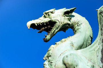 Dragon statue head Ljubljana blue sky