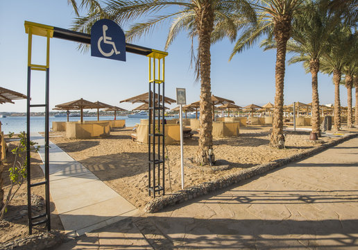 Tropical sandy beach with disabled access at a hotel resort