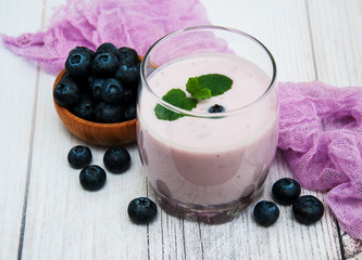 Glass with blueberry yogurt