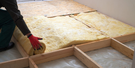 Work composed of mineral wool insulation in the floor, floor heating insulation , warm house,...