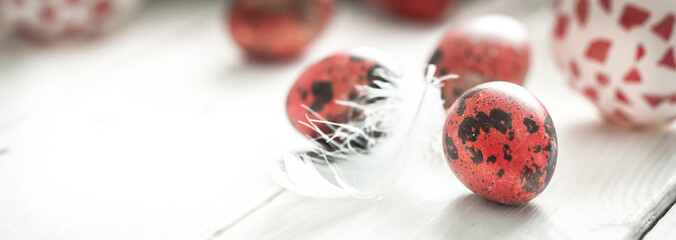 Easter eggs on a light wood background,