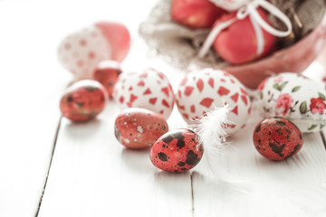 Easter eggs on a light wood background,