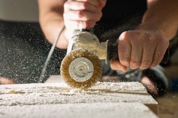 Processing the board with a metal brush. Method of aging of wood.