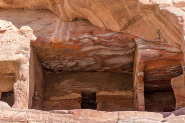 Veins of different shapes, colors and shades on the red rocks of the Royal Tombs of Petra, Jordan, Midle East