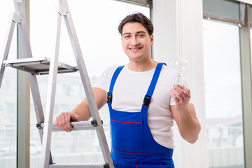 Contractor preparing the change the light bulb