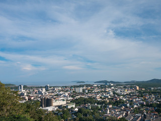 cloudy blue sky background and cityscape from the viewpoint on hilltop