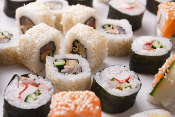 Set of sushi, maki and rolls on white background