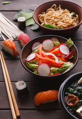 Asian food on wooden background, copy space