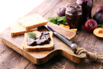 Fresh plum jam with toast or bread for breakfast.