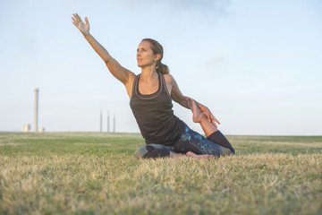 A Young woman doing yoga exercise outdoor