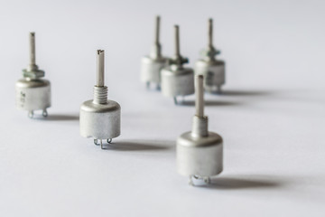 Potentiometers stand on a light background.