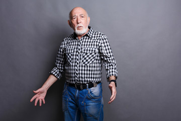 Angry senior man posing, copy space