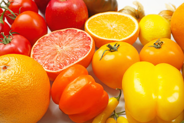Many different fruits and vegetables on light background, closeup