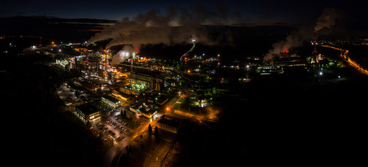 Fototapeta na wymiar Aerial view of oil refinery. Industrial view at oil refinery plants with lots of light at night. Panorama.