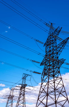  high-voltage  power lines at sunset.