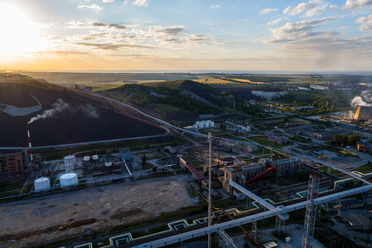 Aerial view Oil refinery with a background of mountains and sky at sunset. Aerial photography. Kohtla-Järve city, Estonia, Ida-Virumaa.