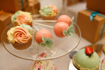Cupcake and other sweets on candy bar. Catering service at wedding day