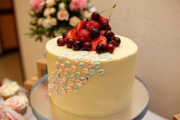 Wedding cake and other sweets on candy bar. Catering service at wedding day