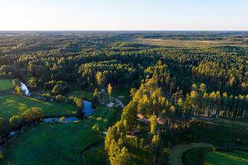 Aerial View. Flying over the beautiful summer rivers at sunset.