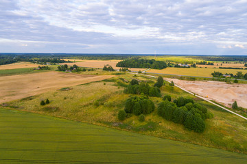 Fototapeta na wymiar Aerial view of amazing summer landscape. Fields and meadows from above.
