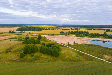 Fototapeta na wymiar Aerial view of amazing summer landscape. Fields and meadows from above.