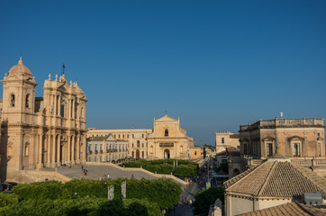 Fototapeta na wymiar View to roofs of Noto baroque town from bell tower of St. Charles Church (Chiesa di San Carlo), Noto, Sicily, Italy