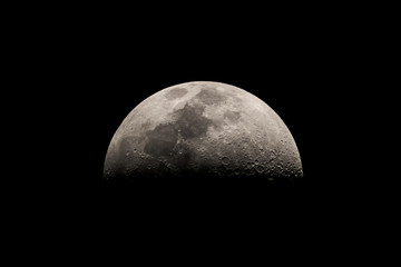 Close up of the first quarter half moon - obrazy, fototapety, plakaty