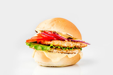 Burger With Beef, Tomato, Cheese, Lettuce and Onion. Close up. On white background.