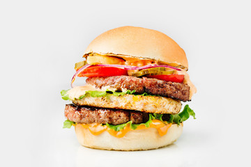 Burger With Beef, Tomato, Cheese, Lettuce and Onion. Close up. On white background.