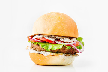 Burger With Beef, Tomato, Cheese, Lettuce and Onion. Close up