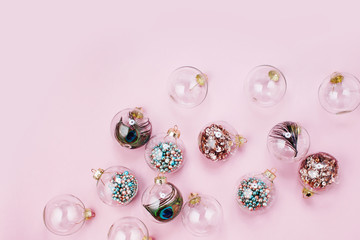 Holiday pattern. Christmas glass transparent ball with colorful sparkle confetti and decoration. Christmas concept