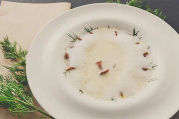 Delicious cream soup with honey fungus close up