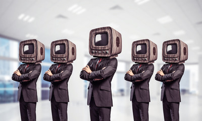 Businessmen with old TV instead of head.
