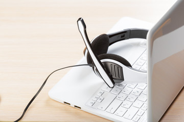 headset on keyboard computer laptop