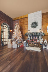 Cozy christmas interior with fir tree and fireplace