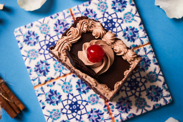 Slice of cherry cake with chocolate