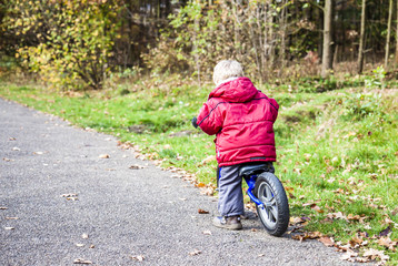 Young boy training on his bike
