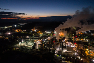Aerial view of oil refinery. Industrial view at oil refinery plants with lots of light at night. 
