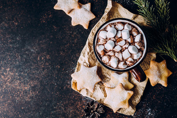 Top view of Hot Christmas Drink. Holiday beverage Cacao or Chocolate with marshmallow and Cookies Shape Star. Stone Background, Copy space