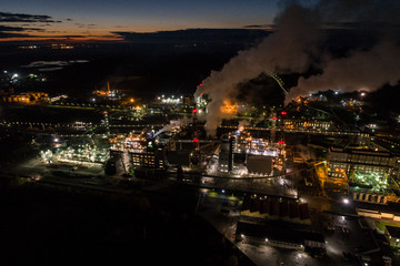 Aerial view of oil refinery. Industrial view at oil refinery plants with lots of light at night. 